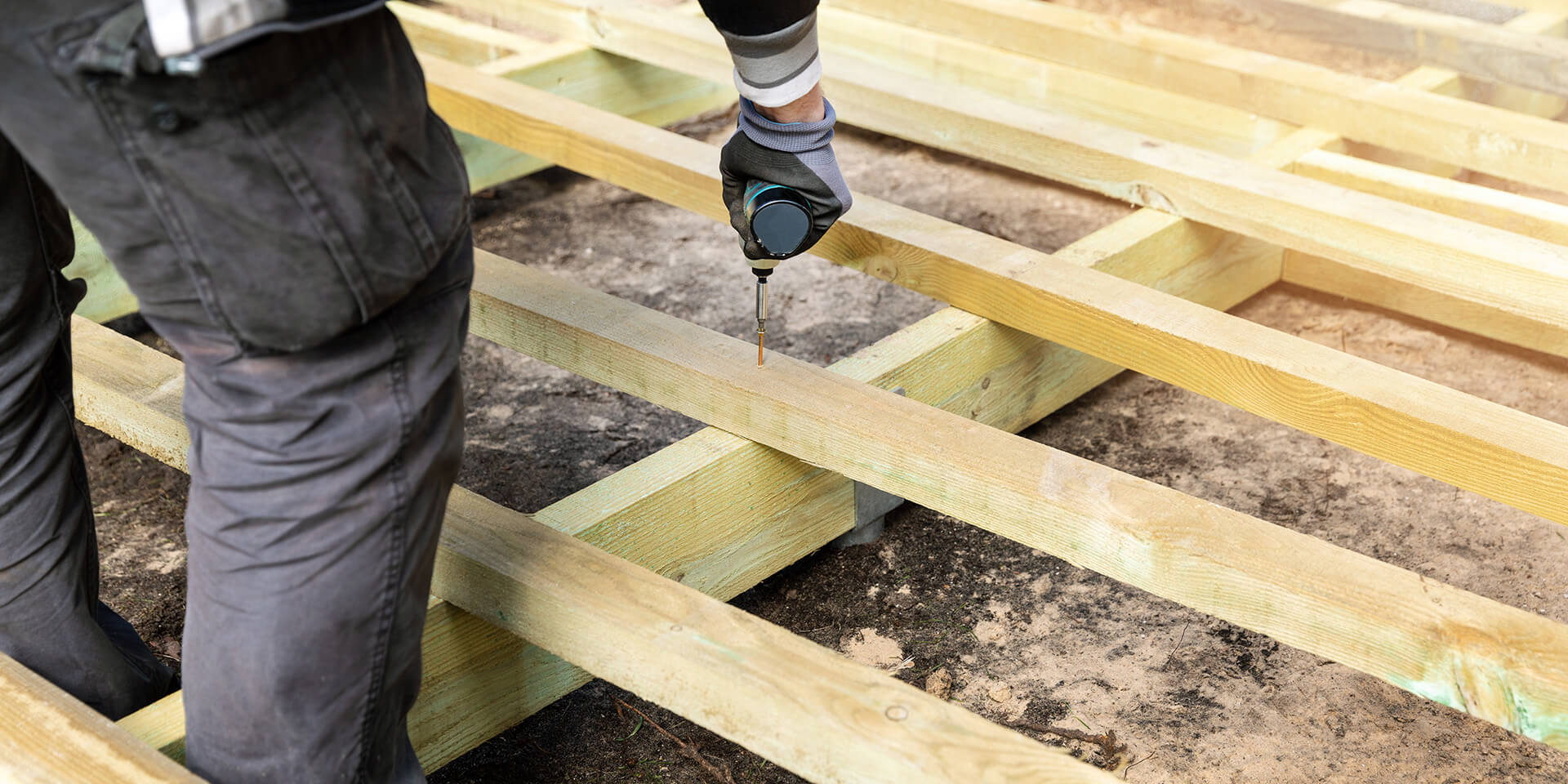 Pro Installer fitting timber joist subframe at 300mm centres.