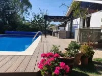 HD Deck Dual decking in oak next to an outdoor swimming pool - Composite Prime